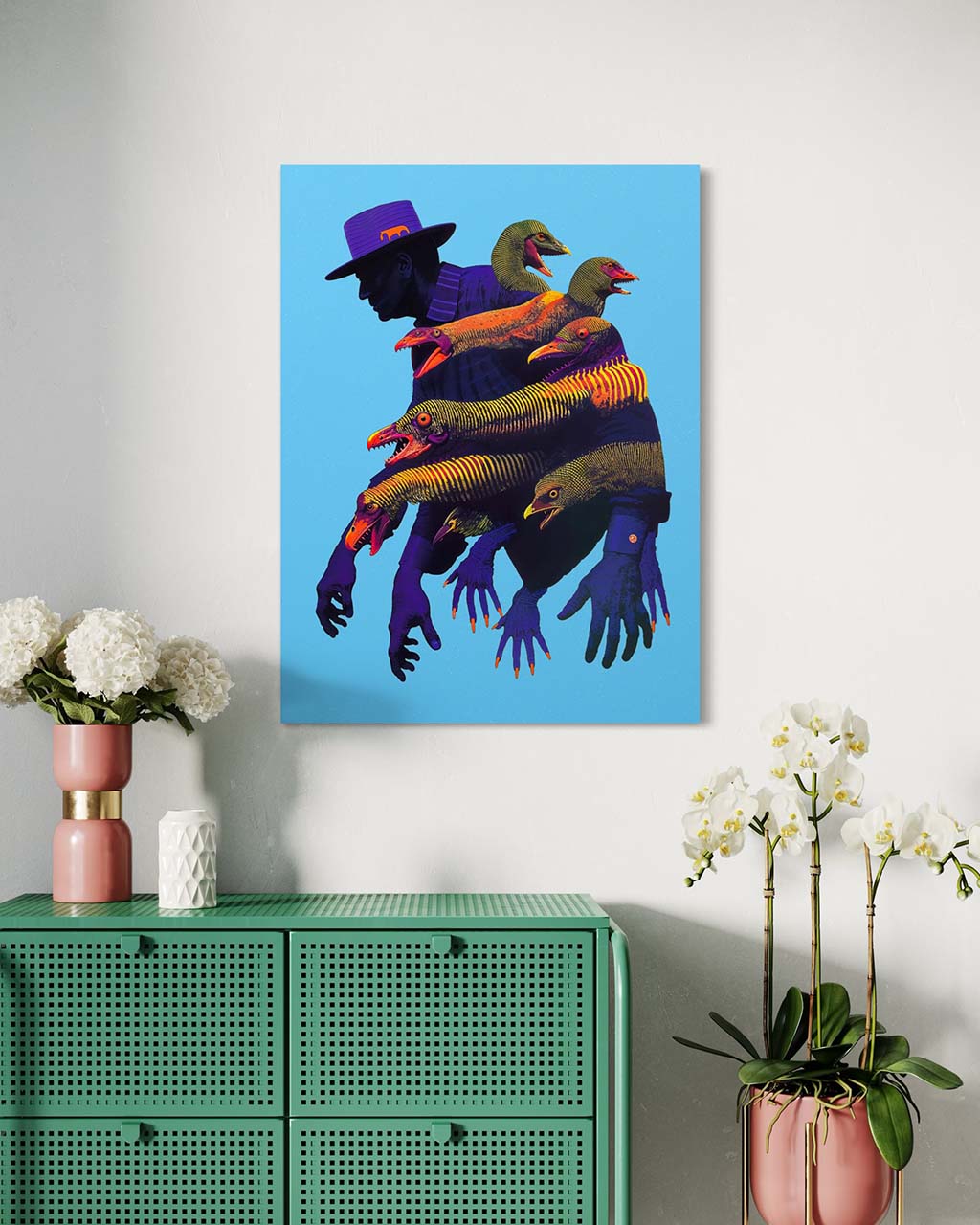 Unframed art poster on the wall. The poster is featuring a shadowy figure surrounded by strange, bird-like creatures with open mouths. 