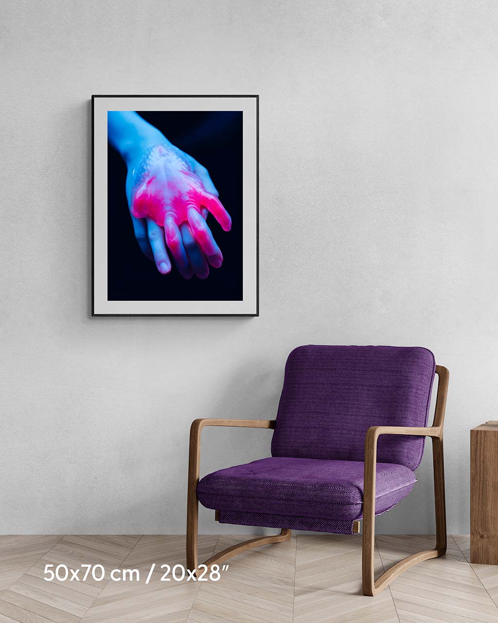 Framed poster on the wall. Poster depicts a weird hand in red and blue.