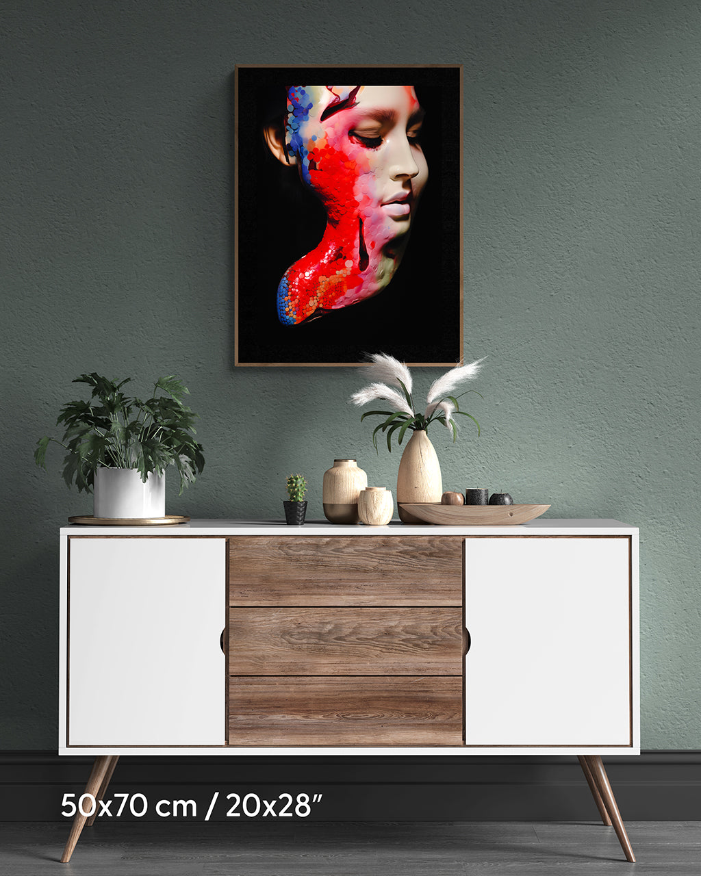 Framed poster on the wall. Poster features a distressed sculpture of a woman's torso with red paint on her body.