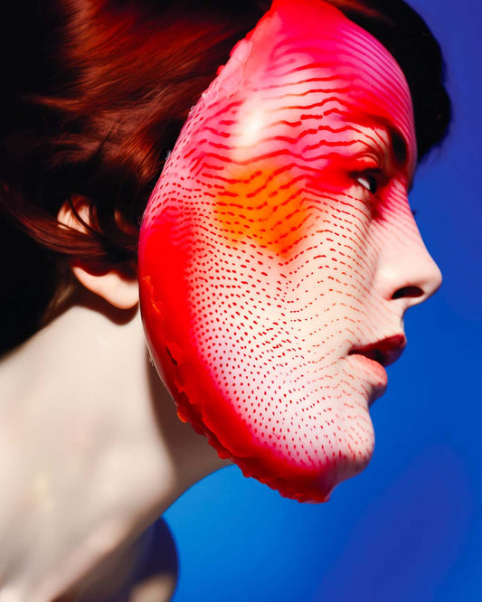 Poster art. Woman wearing a mask and red face paint.