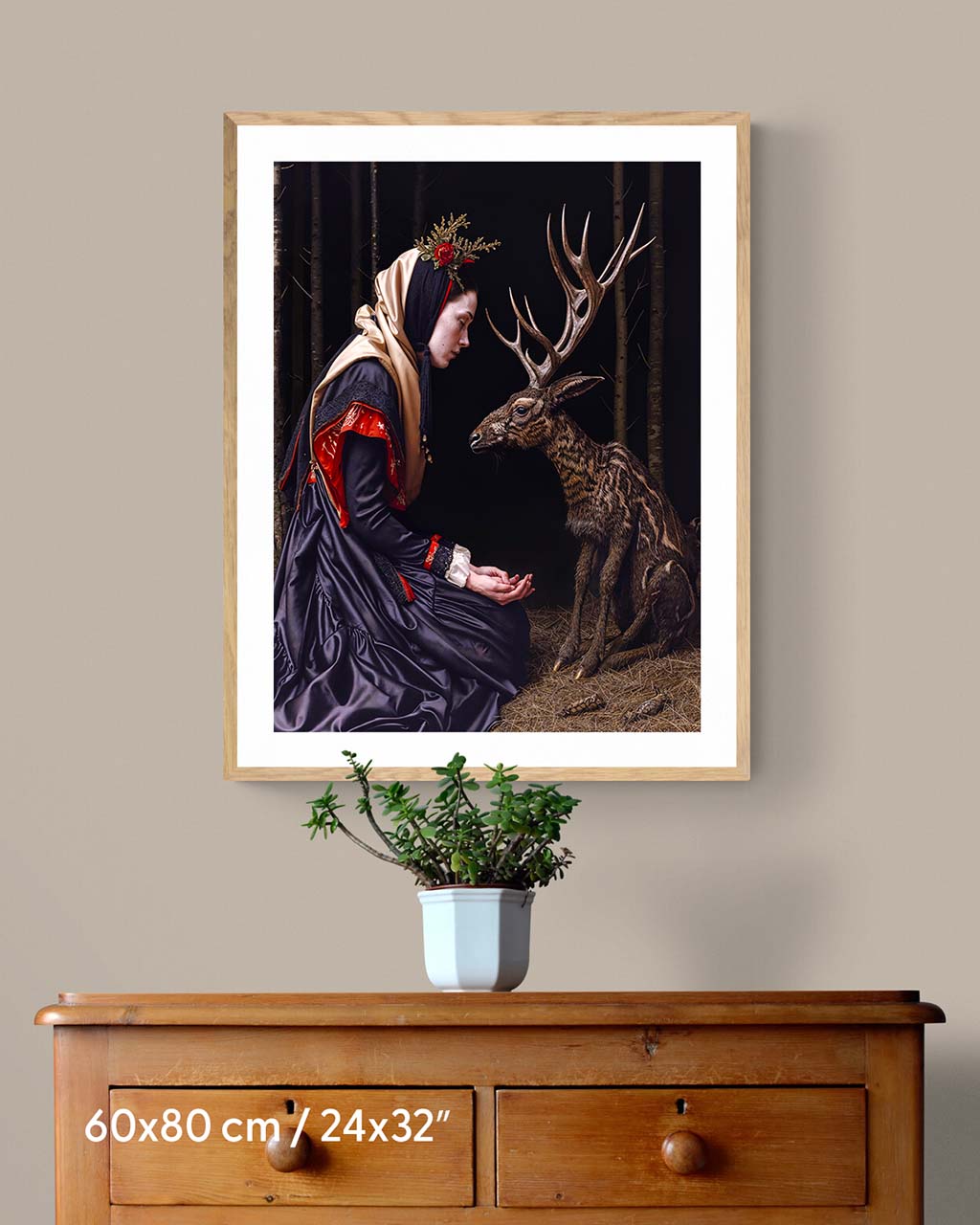 Poster art on the wall featuring a woman feeding a deer in the dark forest