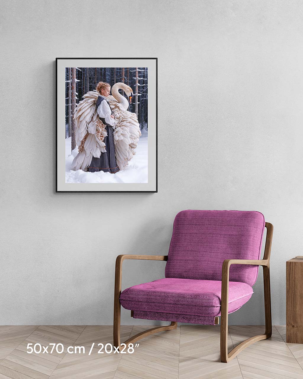 Framed poster on the wall, featuring a woman and a swan standing in a snowy forest.