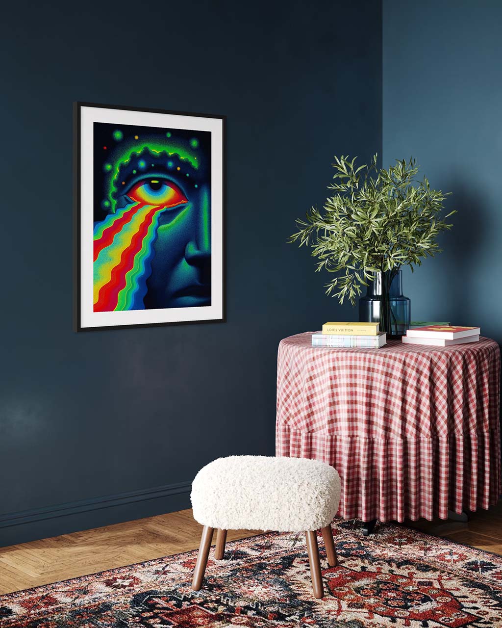 Colorful abstract art on a dark wall with a table and stool below.