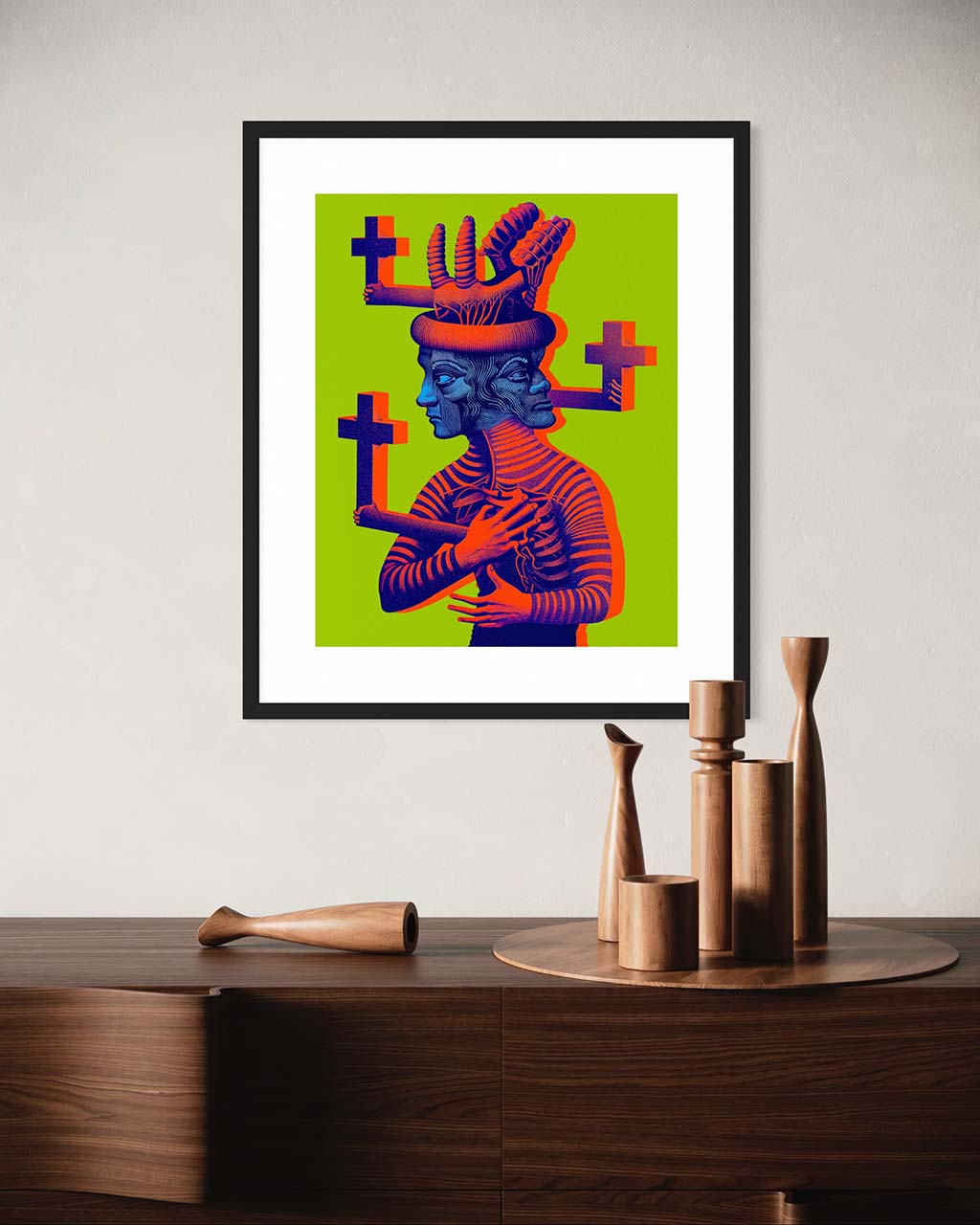 Art poster on the wall. The poster features a cross-covered figure with two faces against bright green background.
